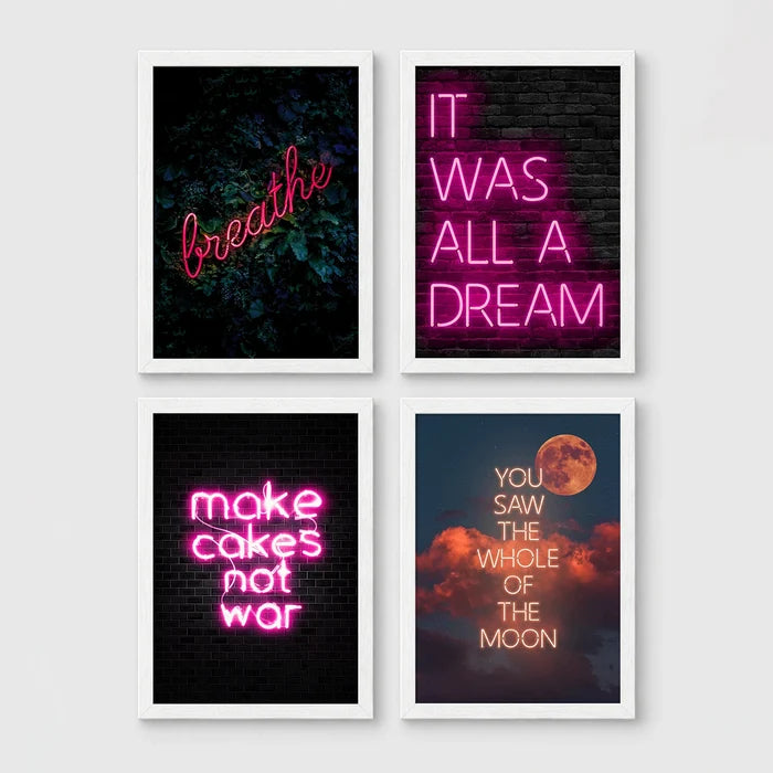 Set of 4 framed prints, pink typographic quote prints: "Let's Stay Home" bold retro typography; a peace-sign hand illustration filled with uplifting text; "This Kitchen Is For Dancing" bold retro typography; and a second peace-sign hand illustration filled with uplifting text — unframed
