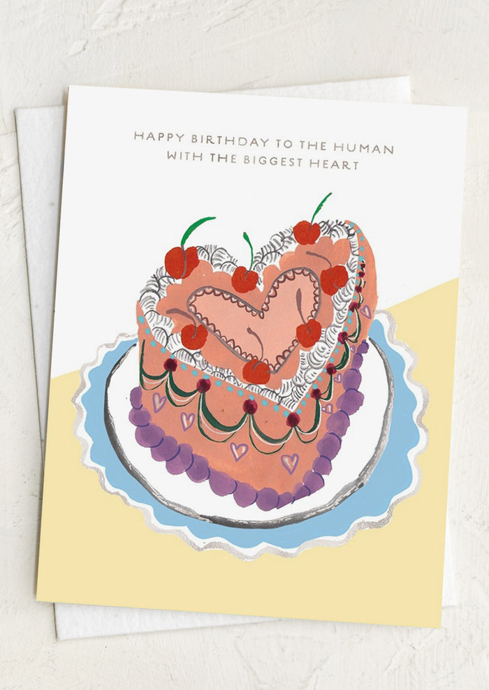 Greeting card with a heart-shaped cake illustration and birthday message on a white background.