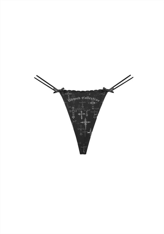 Front view of a black thong featuring double straps and satin ribbons with cross print design.
