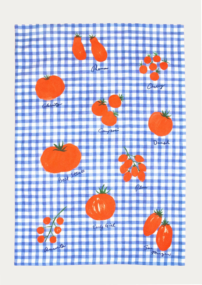 Tea towel with tomato design on a blue and white checkered background