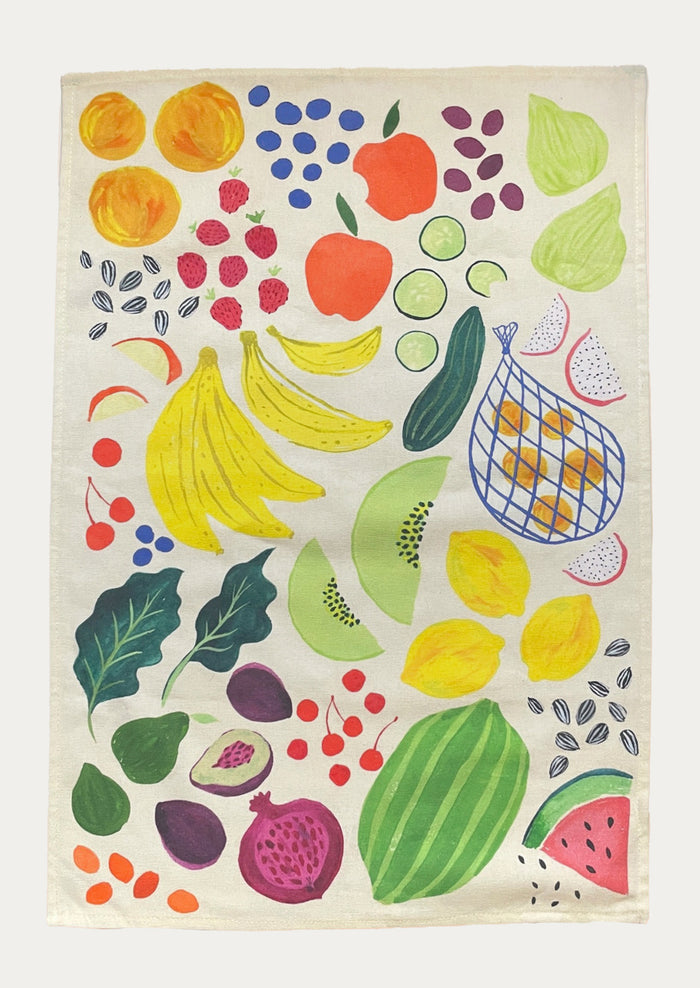 Colorful towel with a pattern of fruits and vegetables on a white background
