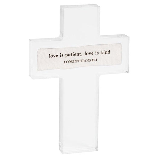 Set of three cross-shaped signs with inspirational quotes on a white background