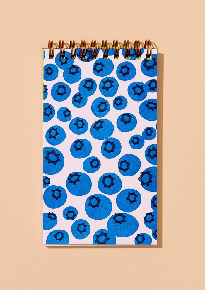 Notebook with blueberry pattern on a beige background