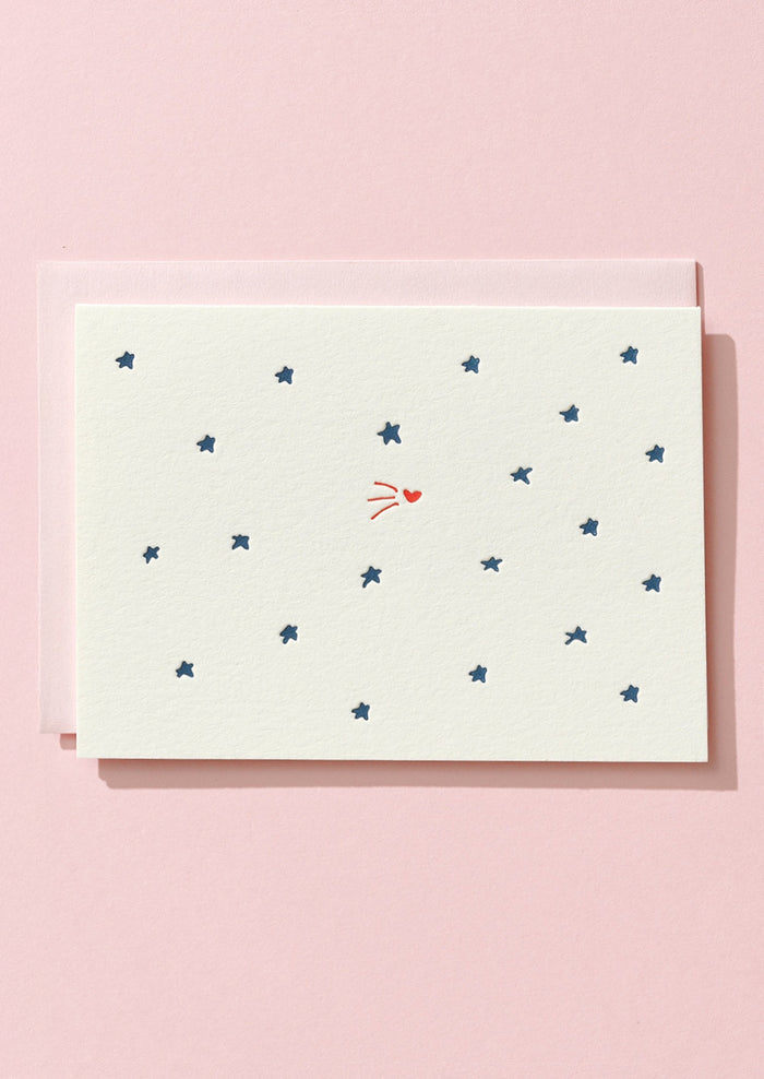 Card with star pattern on a pink background