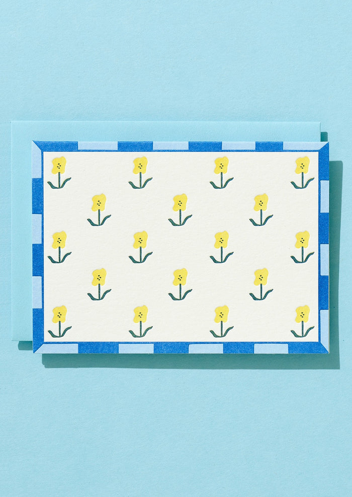 Greeting card with yellow floral design.